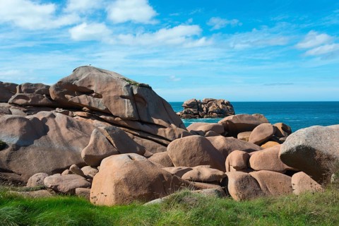 Grassy cliffs overlooking the sea and blue sky, Ploumanac'h, Ploumanach, Perros-Guirec,