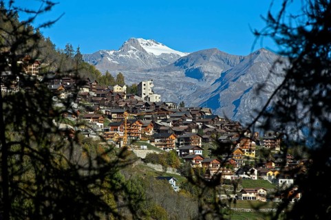The village of Hérémence with the striking concrete church of St Nicolas, Hérémence, Hérens Valley,