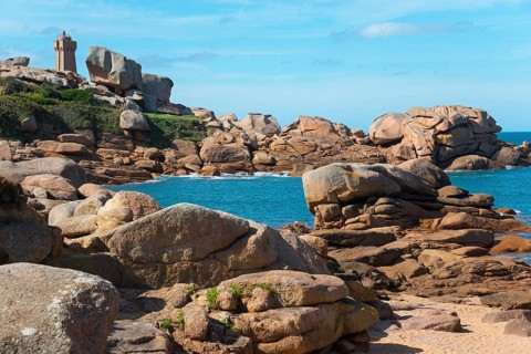 Rocky coast with lighthouse and blue sky in the background, Phare de Men Ruz, Ploumanac'h,