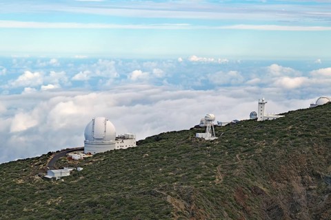 An observatory on a green hill with clouds and sky, trade winds, no light pollution, Observatory,