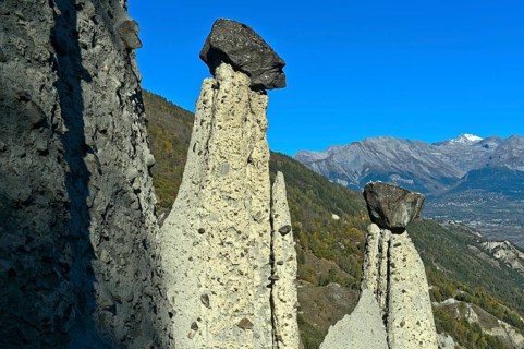 Earth pyramids of Euseigne with cairn, Hérémence, Hérens Valley, Val d'Hérens, Valais, Switzerland,
