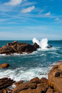 Coastal landscape with rocks and breaking waves on a sunny day, Ploumanac'h, Ploumanach,