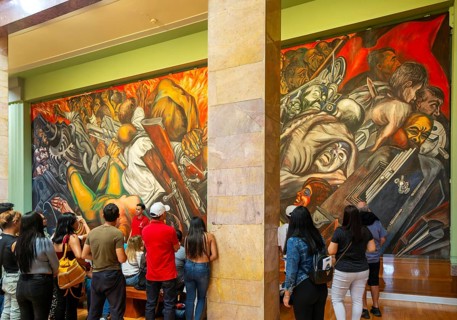People viewing 'Katharsis' 1934 mural by Jose Clemente Orozco, Palacio de Bellas Artes, Palace of