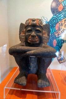 Carved stone crouching figure of god of fire, day and heat Xiuhtecuhtli archaeological site and