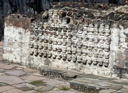 Wall of stone skulls called Tzompantli, archaeological site and museum of Templo Mayor, Mexico