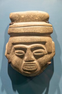 Carved stone Atzec face, archaeological site and museum of Templo Mayor, Mexico City, Mexico,