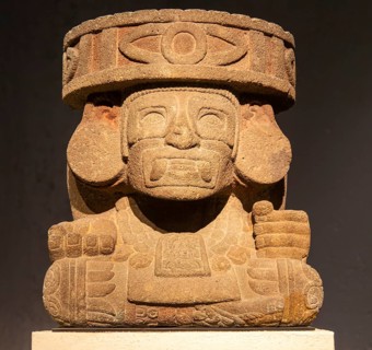 Carved stonework block depicting a masked God, archaeological site and museum of Templo Mayor,