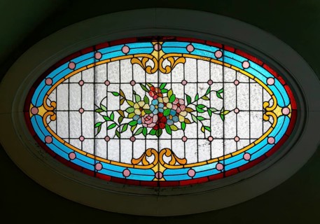 Stained glass oval window inside Casa Molina, Museo de Arte Popular de Yucatan, Merida, Mexico,