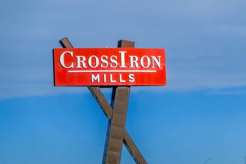 Rocky View, Alberta, Canada. Feb 19, 2024. CrossIron Mills sign, a fully enclosed shopping centre