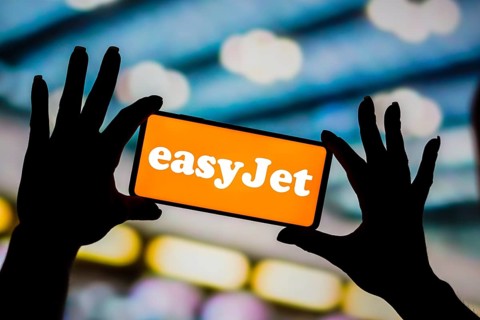 In this photo illustration, the EasyJet Airlines logo is displayed on a smartphone screen