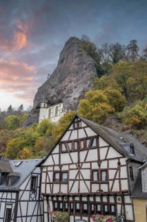 An old half-timbered town in autumn. A church was built into a rock here. Unique German