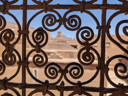 Ornate traditional window grid of a berber house ruin in the city center of Amezrou, Morocco,