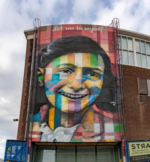 A picture of the Let Me Be Myself colorful mural, depicting Anne Frank, created by Eduardo Kobra in