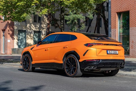 A picture of an orange Lamborghini Urus