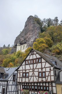 An old half-timbered town in autumn. A church was built into a rock here. Unique German