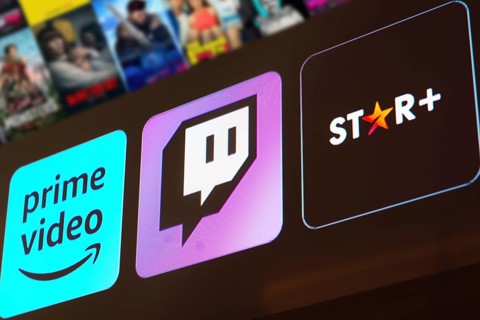 In this photo illustration the Amazon Prime Video, Twitch and Star Plus logo is displayed on a TV