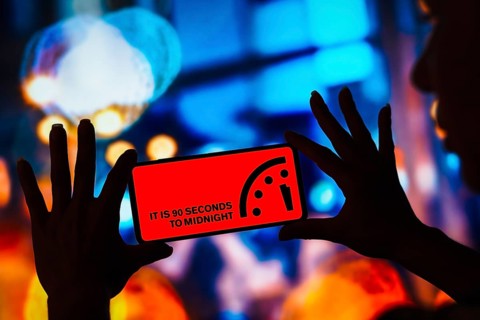 In this photo illustration, the Doomsday Clock at record 90 seconds to midnight is displayed on a