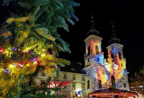 Beautiful Christmas decorations and Mariahilfer church, at night, in the city center of Graz,