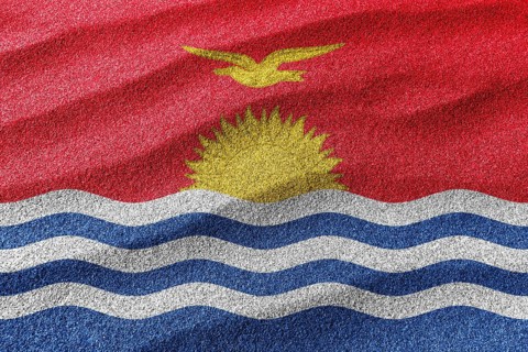 Kiribati sand flag, national flag sand background