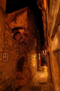 Little narrow mediterranean alley in downtown Trogir, Croatia, Europe
