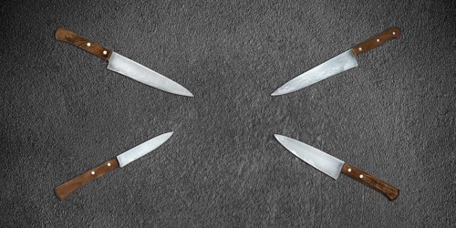 Topview of Set Cooking Knives on Dark Background
