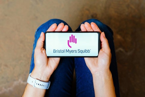 In this photo illustration, the Bristol Myers Squibb (BMS) logo is displayed on a smartphone screen