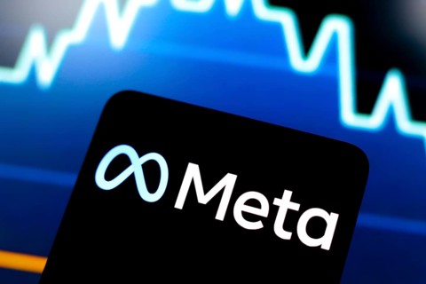 In this photo illustration, the Meta logo is displayed on a smartphone screen and in the