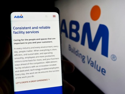 Stuttgart, Germany, 03-13-2024: Person holding mobile phone with web page of US facility management