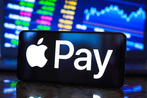 In this photo illustration, the Apple Pay logo is displayed on a smartphone screen