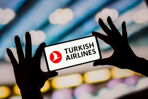 In this photo illustration, the Turkish Airlines logo is displayed on a smartphone screen
