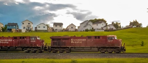 Calgary, Alberta, Canada. Aug 2, 2024. A Canadian Pacific Railway train passes through a suburban