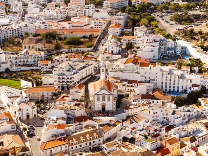 Aerial View of residential houses and Mother Church in Albufeira, Algarve, Portugal, Europe