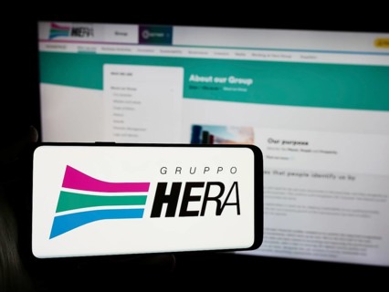 Stuttgart, Germany, 06-01-2024: Person holding smartphone with logo of Italian utility company Hera