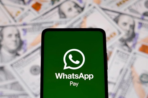 In this photo illustration the WhatsApp Pay logo seen displayed on a smartphone
