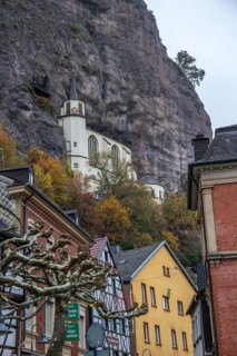 An old half-timbered town in autumn. A church was built into a rock here. Unique German