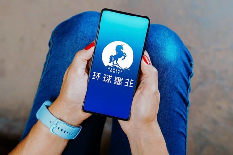 In this photo illustration, the Global Mofy Metaverse Limited logo is displayed on a smartphone