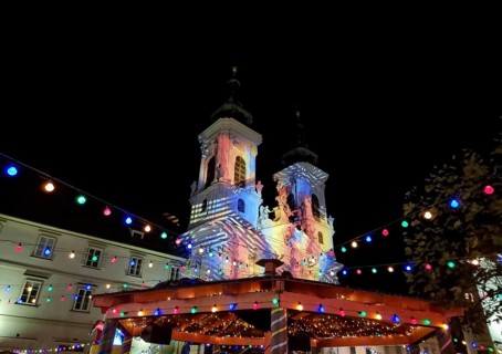 Beautiful Christmas decorations and Mariahilfer church, at night, in the city center of Graz,
