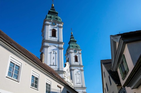 The two towers of the former collegiate church of St Peter, a Roman Catholic parish church, Bad