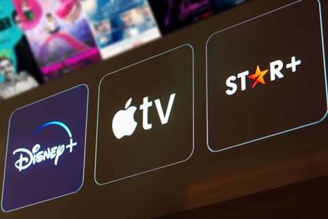 In this photo illustration the Disney Plus, Apple TV and Star Plus logo is displayed on a TV screen