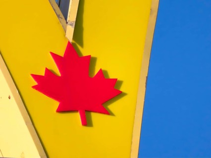 Calgary, Alberta, Canada. Oct 8, 2023. A close up to a Canadian maple leaf of a McDonalds fast food