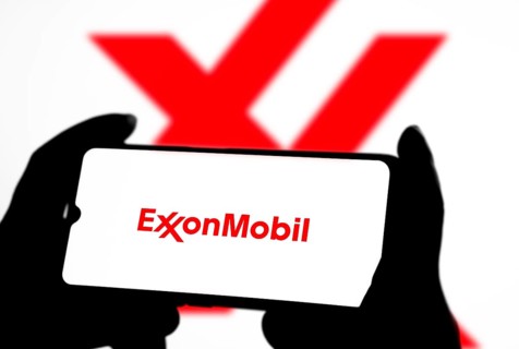 ExxonMobil Corporation Logo on a mobile screen stock image. It's a major multinational publicly