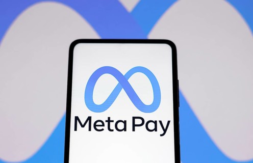 In this photo illustration the Meta Pay logo seen displayed on a smartphone and in the background