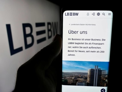 Stuttgart, Germany, 07-15-2024: Person holding cellphone with webpage of German company Landesbank