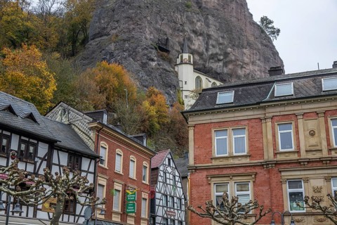 An old half-timbered town in autumn. A church was built into a rock here. Unique German