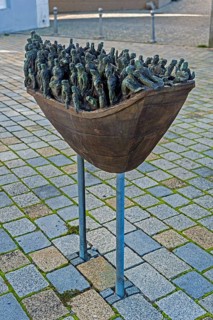 Figures in a boat, bronze artwork at the former collegiate church of St Peter, a Roman Catholic