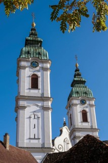 The two towers of the former collegiate church of St Peter, a Roman Catholic parish church, Bad