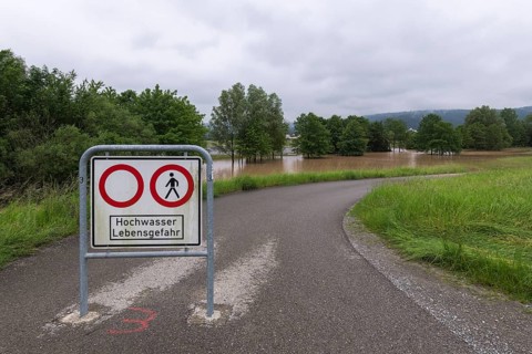 Symbolic image extreme weather, global warming, climate change, information board, flood retention