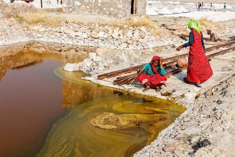 SAMBHAR, INDIA, NOVEMBER 19, 2012: Women mining salt at lake Sambhar, Rajasthan, India. Sambhar