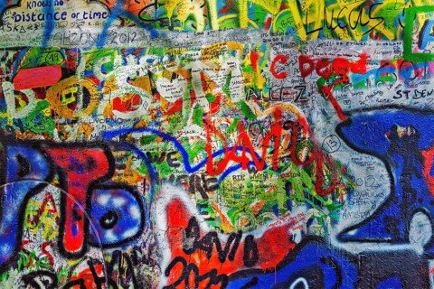 PRAGUE, CZECH REPUBLIC, APRIL 28, 2012: Lennon Wall is filled with John Lennon-inspired graffiti