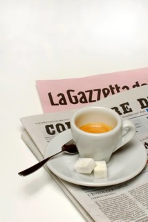 Cup of espresso with sugar on newspaper, household sugar, sugar cubes, coffee